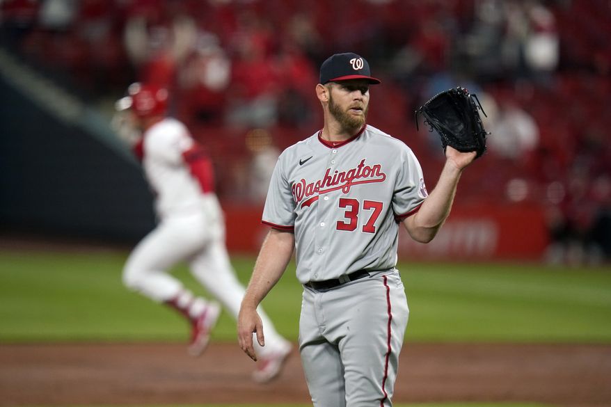 Washington Nationals starting pitcher Stephen Strasburg (37) waits for a new ball as St. Louis Cardinals&#39; Nolan Arenado rounds the bases after hitting a two-run home run during the third inning of a baseball game Tuesday, April 13, 2021, in St. Louis. (AP Photo/Jeff Roberson)