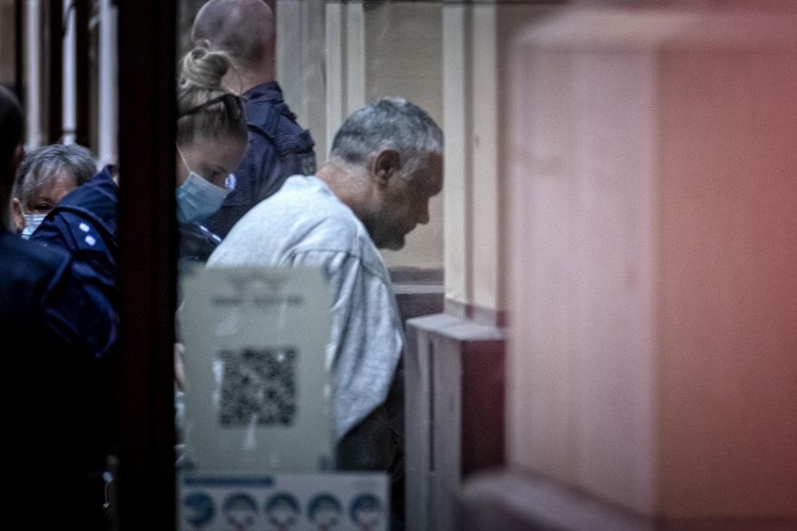 Mohinder Singh, right, arrives at the Supreme Court of Victoria for his sentence hearing in Melbourne, Wednesday, April 14, 2021. Singh, a truck driver, has been imprisoned 22 years for hitting and killing four police officers on an Australian freeway. (Luis Ascui/AAP Image via AP)