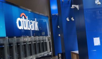 A Citibank office is open, Wednesday, Jan. 13, 2021 in New York.   The nation’s largest banks are expected to report big profits for the first quarter, Tuesday, April 13,  amid renewed confidence that pandemic-battered consumers and businesses can repay their debts and start borrowing again  (AP Photo/Mark Lennihan)