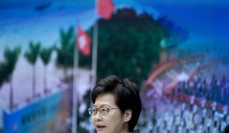 Hong Kong Chief Executive Carrie Lam speaks during a press conference in Hong Kong, Tuesday, April 13, 2021. Lam said Tuesday that Hong Kong&#39;s legislative elections would take place in December, more than a year after they were postponed last year with authorities citing public health risks from the coronavirus pandemic. (AP Photo/Vincent Yu)