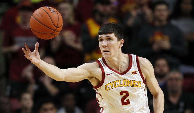 FILE - Iowa State guard Caleb Grill reaches for the basketball during the first half of an NCAA college basketball game against Southern Mississippi in Ames, Iowa, in this Tuesday, Nov. 19, 2019, file photo. Caleb Grill will transfer back to Iowa State after playing last season at UNLV, coach T.J. Otzelberger announced Tuesday, April 13, 2021. (AP Photo/Charlie Neibergall, File)