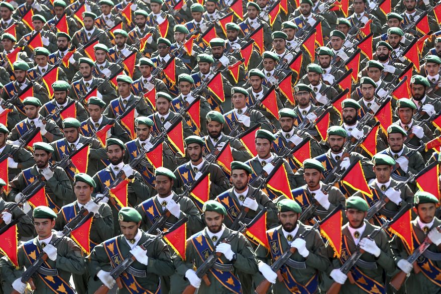 FILE - In this Sept. 21, 2016, file photo, Iran’s Revolutionary Guard troops march in a military parade in Tehran, Iran. Sabotage on Sunday, April 11, 2021, at Iran’s main nuclear enrichment facility is just the latest setback for the Guard, though the paramilitary force is rarely publicly criticized due to its power. But with some of its leaders now considering vying for the presidency, the Guard’s influence and failures could become fair game. (AP Photo/Ebrahim Noroozi, File)