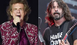Musician Mick Jagger of The Rolling Stones performs in East Rutherford, N.J. on Aug. 1, 2019, left, Dave Grohl of the Foo Fighters performs at Pilgrimage Music and Cultural Festival in Franklin, Tenn. on Sept. 22, 2019. Jagger and Grohl have teamed up for a hard-rock pandemic anthem called “Eazy Sleazy.” The duo recorded the song in different studio locations and the lyrics mention “prison walls,” “virtual premieres,” numbers that are “grim” and Zoom calls. (AP Photo)