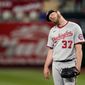 Washington Nationals starting pitcher Stephen Strasburg stands on the mound after giving up a two-run home run to St. Louis Cardinals&#39; Matt Carpenter during the third inning of a baseball game Tuesday, April 13, 2021, in St. Louis. (AP Photo/Jeff Roberson)