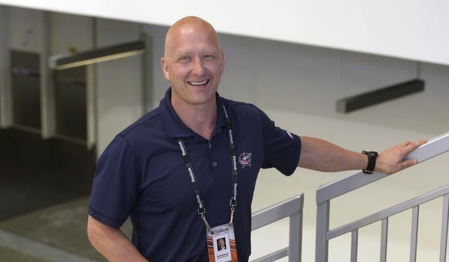 In this June 6, 2015, file photo, Columbus Blue Jackets general manager Jarmo Kekalainen poses for a photo as he watches NHL draft prospects test during the NHL Combine in Buffalo, N.Y. Kekalainen sees the overhaul of the Blue Jackets not as a rebuilding but “an opportunity to reload.&amp;quot; (AP Photo/Gary Wiepert, File) **FILE**
