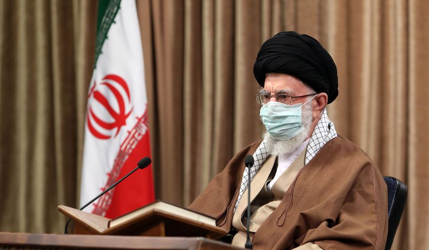 In this picture released by an official website of the office of the Iranian supreme leader, Supreme Leader Ayatollah Ali Khamenei wearing a protective face mask, attends a meeting in Tehran, Iran, Wednesday, April 14, 2021. Khamenei said Wednesday that the offers being made at the Vienna talks over his country&#39;s tattered nuclear deal &quot;are not worth looking at.&quot; (Office of the Iranian Supreme Leader via AP)