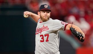 Washington Nationals starting pitcher Stephen Strasburg throws during the third inning of a baseball game against the St. Louis Cardinals Tuesday, April 13, 2021, in St. Louis. (AP Photo/Jeff Roberson)