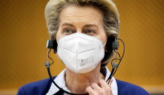 European Commission President Ursula von der Leyen listens to statements during a meeting of the Conference of Presidents at the European Parliament in Brussels, Tuesday, April 13, 2021. (AP Photo/Francisco Seco, Pool)