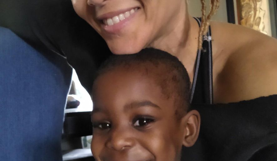 This 2021 photo provided by Bridgette Griffin shows her and her daughter, Aubrey Faith Griffin, on Aubrey's third birthday at their home in Atlanta. Griffin, adopted Aubrey from foster care and been a foster parent to many other children, including teenage girls and babies. Though she thrives on being a foster mom, she sees traces of racism ingrained in the child-welfare system. "You see the difference in the courts - two kids coming in for the same type of neglect,” she said, “The judge looks at them differently, the social workers deal with them differently. There’s more sympathy for the white parents, unfortunately. ... It’s not fair.” (Bridgette Griffin via AP)