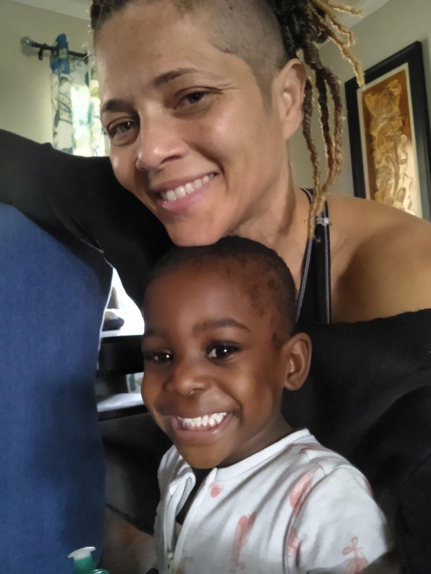 This 2021 photo provided by Bridgette Griffin shows her and her daughter, Aubrey Faith Griffin, on Aubrey's third birthday at their home in Atlanta. Griffin, adopted Aubrey from foster care and been a foster parent to many other children, including teenage girls and babies. Though she thrives on being a foster mom, she sees traces of racism ingrained in the child-welfare system. "You see the difference in the courts - two kids coming in for the same type of neglect,” she said, “The judge looks at them differently, the social workers deal with them differently. There’s more sympathy for the white parents, unfortunately. ... It’s not fair.” (Bridgette Griffin via AP)