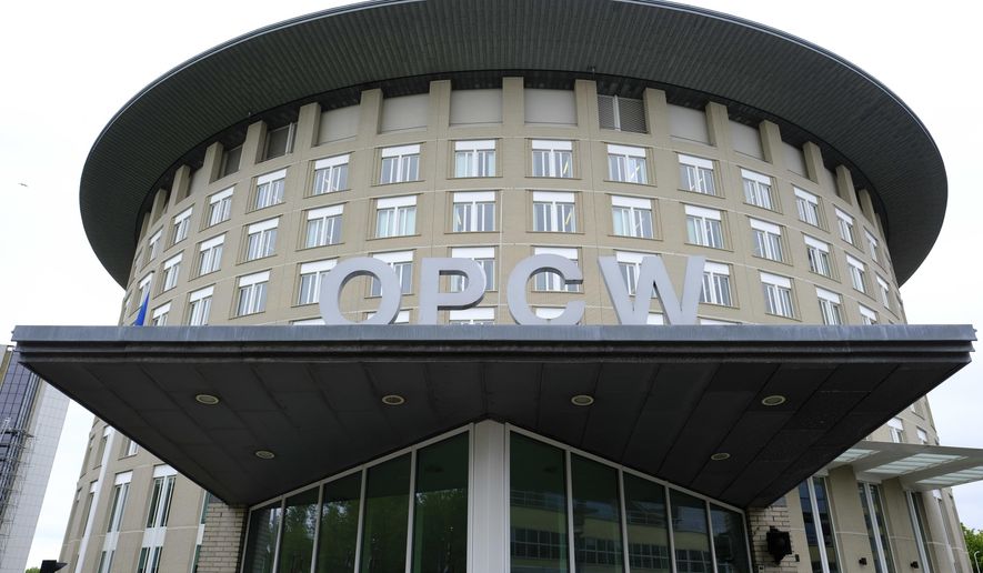 FILE - This Friday May 5, 2017 file photo shows the headquarters of the Organisation for the Prohibition of Chemical Weapons (OPCW), The Hague, Netherlands. An investigation by the global chemical weapons watchdog found “reasonable grounds to believe” that a Syrian air force military helicopter dropped a chlorine cylinder on a Syrian town in 2018, sickening 12 people, the Organization for the Prohibition of Chemical Weapons said Monday, April 12, 2021.(AP Photo/Peter Dejong, File)