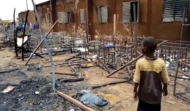 This image taken from Associated Press video, shows burnt chairs, tables and other objects in the school, in Niamey, Niger, Wednesday April 14, 2021. Hospital officials say a fire at an elementary school in Niger&#x27;s capital has killed 20 children. It was not immediately known what started the fire on Tuesday afternoon but authorities said that high winds in the area allowed the blaze to spread rapidly. (AP Photo/Boureima Issoufou)
