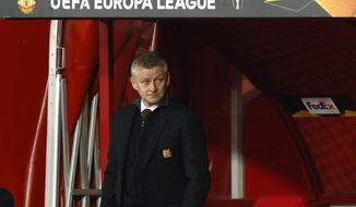 Manchester United&#39;s manager Ole Gunnar Solskjaer stands near the bench during the Europa League, quarterfinal, first leg soccer match between Granada and Manchester United at the Los Carmenes stadium in Granada, Spain, Thursday, April 8, 2021. (AP Photo/Fermin Rodriguez)