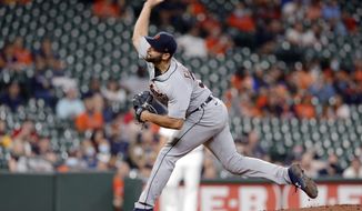 Detroit Tigers starting pitcher Michael Fulmer throws against the Houston Astros during the first inning of a baseball game Wednesday, April 14, 2021, in Houston. (AP Photo/Michael Wyke)