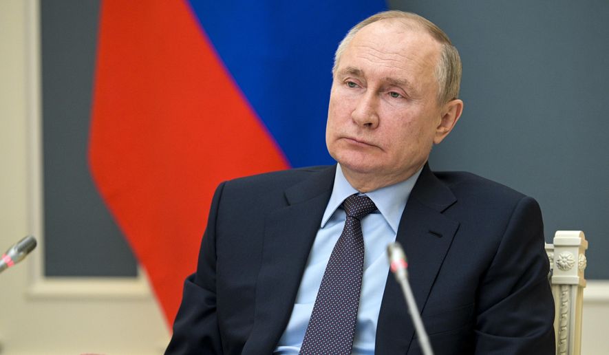 Russian President Vladimir Putin attends a session of the Russian Geographical Society via video link in Moscow, Russia, Wednesday, April 14, 2021. (Alexei Druzhinin, Sputnik, Kremlin Pool Photo via AP)