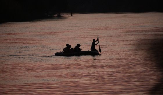 Some smugglers use inflatable rafts to take families across the Rio Grande from Mexico to the U.S. Authorities in Texas have reported an increase in drownings in the river this year. (Associated Press)