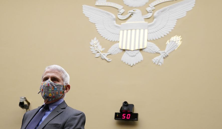 Dr. Anthony Fauci, the nation&#39;s top infectious disease expert, waits for the start of a House Select Subcommittee on the Coronavirus Crisis hearing on Capitol Hill in Washington, Thursday, April 15, 2021. (AP Photo/Susan Walsh, Pool)