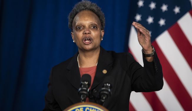 Mayor Lori Lightfoot discusses the videos of 13-year-old Adam Toledo, who was fatally shot by a Chicago police officer, during a news conference at City Hall, Thursday, April 15, 2021. Lightfoot urged the public to remain peaceful and reserve judgement until an independent board can complete its investigation into the police shooting of Toledo last month. (Ashlee Rezin Garcia/Chicago Sun-Times via AP)