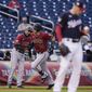 Arizona Diamondbacks&#39; Carson Kelly, center, runs the bases on a solo home run as Washington Nationals starting pitcher Patrick Corbin, right, stands on the mound during the first inning of a baseball game at Nationals Park, Thursday, April 15, 2021, in Washington. (AP Photo/Alex Brandon)