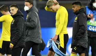 Dortmund&#39;s Erling Haaland is dejected after the Champions League quarterfinal second leg soccer match between Borussia Dortmund and Manchester City at the Signal Iduna Park stadium in Dortmund, Germany, Wednesday, April 14, 2021. (AP Photo/Martin Meissner, Pool)
