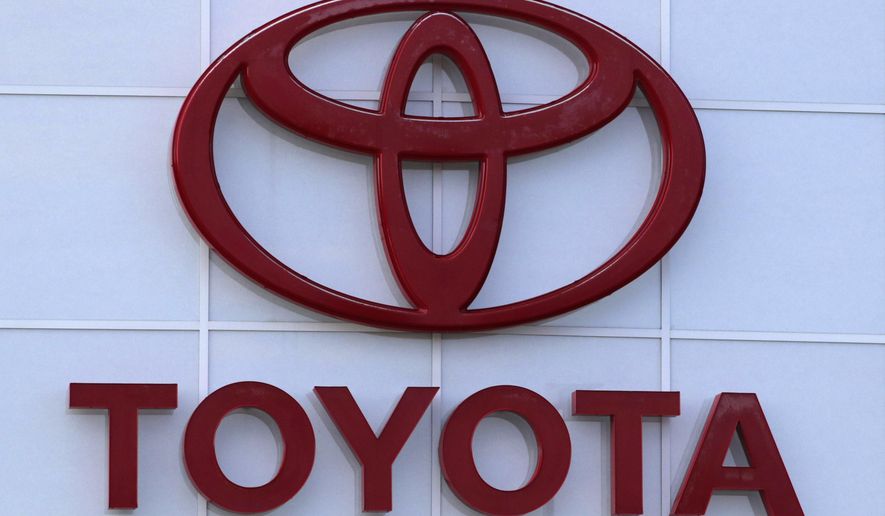 This Aug. 15, 2019 file photo shows the Toyota logo on a dealership in Manchester, N.H. Toyota is recalling nearly 280,000 Venza SUVs in the U.S., Thursday, April 15, 2021,  because a wiring problem could stop the side air bags from inflating in a crash. The recall covers Venzas from the 2009 through 2015 model years.   (AP Photo/Charles Krupa, File)
