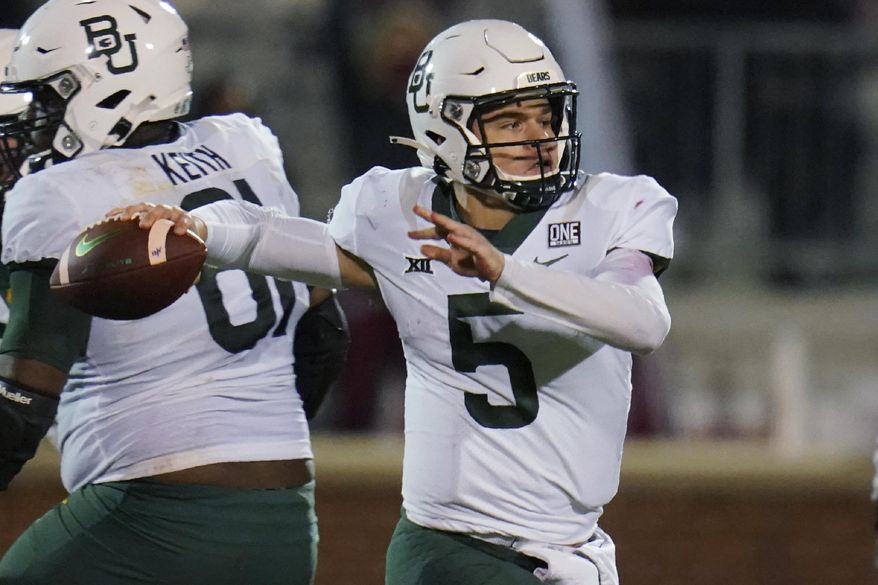FILE - Baylor quarterback Charlie Brewer prepares to throw a pass during the first half of the team's NCAA college football game against Oklahoma in Norman, Okla., in this Saturday, Dec. 5, 2020, file photo. Charlie Brewer is on a mission to make a name for himself as Utah's newest quarterback. Since his high school days, when he was lightly recruited before signing with Baylor, Brewer has driven himself to prove his doubters wrong. Now his competitive spirit is giving him the inside track to win the starting quarterback job with the Utes. (AP Photo/Sue Ogrocki, File)