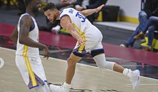 Golden State Warriors&#39; Stephen Curry (30) celebrates after a three-point basket in the second half of an NBA basketball game against the Cleveland Cavaliers, Thursday, April 15, 2021, in Cleveland. (AP Photo/David Dermer)