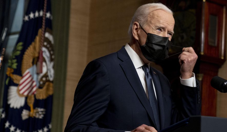In this Wednesday, April 14, 2021, photo, President Joe Biden removes his mask to speak at a news conference at the White House, in Washington. (AP Photo/Andrew Harnik) **FILE**