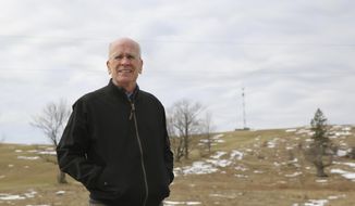 Democratic U.S. Rep. Peter Welch stands for a photograph on a road in Derby Line, Vt., Monday, April 5, 2021. Welch spoke at a news conference about a plan to install surveillance towers along the Vermont border with the Canadian province of Quebec. Behind him is a temporary tower on the spot where a permanent, larger tower would be located. Welch and others say they want to know more about the proposal. U.S Customs and Border Protection say the towers would provide them with more surveillance and detection capabilities along the border. (AP Photo/Wilson Ring)