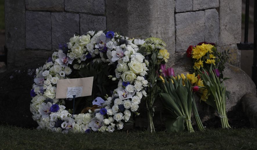 A wreath laid by Andre and Stan Walker for Prince Philip outside Windsor Castle in Windsor, England, Friday, April 16, 2021. Prince Philip husband of Britain&#x27;s Queen Elizabeth II died April 9, aged 99, his funeral will take place Saturday at Windsor Castle in St George&#x27;s Chapel. (AP Photo/Alastair Grant)