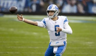 FILE - In this Dec. 20, 2020, file photo, Detroit Lions quarterback Matthew Stafford throws a pass during the second quarter of the team&#39;s NFL football game against the Tennessee Titans in Nashville, Tenn. One after another, quarterbacks once believed to be franchise cornerstones after being top five picks changed addresses this offseason in staggering succession. Stafford and Jared Goff switched teams in a swap of former No. 1 overall picks. (AP Photo/Brett Carlsen, File)