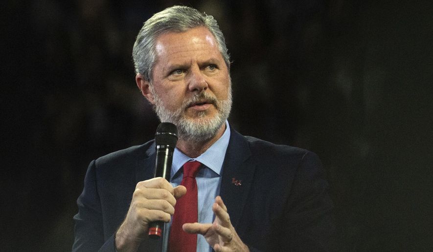 In this, Nov. 13, 2019, photo, then-Liberty University President Jerry Falwell Jr. talks to Donald Trump Jr. about his new book &quot;Triggered&quot; during convocation at Liberty University in Lynchburg, Va. Mr. Falwell took to his social media accounts to defend his faith after a scorching profile in Vanity Fair magazine. (Emily Elconin/The News &amp;amp; Advance via AP) **FILE**
