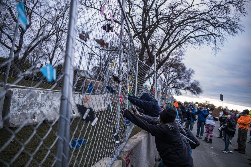 People protest near the Brooklyn Center Police Department on Thursday, April 15, 2021, in Brooklyn Center, Minn., over the fatal shooting of Daunte Wright, a 20-year-old Black man, during a traffic stop. (Richard Tsong-Taatarii/Star Tribune via AP)