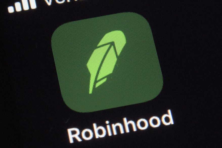 FILE - This Thursday, Dec. 17, 2020 photo shows the logo for the Robinhood app on a smartphone in New York.  Stakes are rising in Massachusetts’ legal battle against Robinhood Financial, and regulators are asking for the popular trading app&#39;s brokerage registration to be revoked, which would effectively bar it from the state.  Robinhood, meanwhile, calls the complaint brought by Secretary of the Commonwealth William Galvin&#39;s office elitist and based on a rule that should not apply in its case. It’s asking to move the issue to a state court, rather than continue to work through an administrative process. (AP Photo/Patrick Sison)