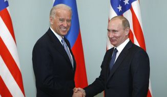 FILE - In this March 10, 2011, file photo, then-Vice President Joe Biden, left, shakes hands with Russian Prime Minister Vladimir Putin in Moscow, Russia. Hit by a barrage of new sanctions from the Biden administration, the Kremlin is carefully weighing its response in a tense showdown with the United States. (AP Photo/Alexander Zemlianichenko, File)