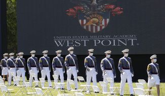 FILE - In this June 13, 2020, file photo, United States Military Academy graduating cadets, wearing face masks, march to their socially-distanced seating during commencement ceremonies in West Point, N.Y. Most of the 73 West Point cadets accused in the biggest cheating scandal in decades at the U.S. Military Academy are being required to repeat a year, and eight were expelled, academy officials said Friday, April 16, 2021. (AP Photo/John Minchillo, Pool, File) (AP Photo/John Minchillo, Pool, File)