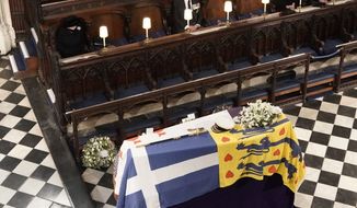 Britain&#39;s Queen Elizabeth II, left, Prince Andrew, Princess Anne the Princess Royal and Vice Admiral Timothy Laurence, right, look on the flag draped coffin in St. George’s Chapel during the funeral of Prince Philip, the man who had been by the Queen&#39;s side for 73 years, at Windsor Castle, Windsor, England, Saturday April 17, 2021. Prince Philip died April 9 at the age of 99 after 73 years of marriage to Britain&#39;s Queen Elizabeth II. (Jonathan Brady/Pool via AP)