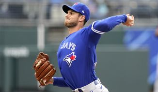Toronto Blue Jays starting pitcher Steven Matz throws during the first inning in the first baseball game of a doubleheader against the Kansas City Royals Saturday, April 17, 2021, in Kansas City, Mo. (AP Photo/Charlie Riedel)