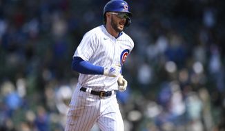 Chicago Cubs Kris Bryant rounds the bases after hitting a two-run home run during the fifth inning of a baseball game against the Atlanta Braves Saturday, April 17, 2021, in Chicago. (AP Photo/Paul Beaty)