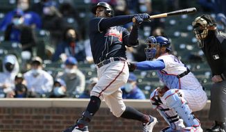 Atlanta Braves&#39; Sean Kazmar Jr. bats during the fifth inning of a baseball game against the Chicago Cubs, Saturday, April 17, 2021, in Chicago. Kazmar Jr. returned to the major leagues after an 13-year absence, pinch hitting for the Braves. (AP Photo/Paul Beaty)