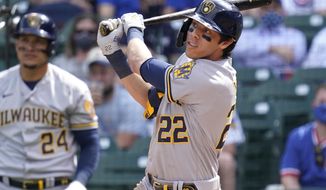 Milwaukee Brewers&#39; Christian Yelich watches after hitting a double against the Chicago Cubs during the fourth inning of a baseball game in Chicago, Wednesday, April 7, 2021. (AP Photo/Nam Y. Huh)