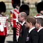 Britain&#39;s Prince William, left, and Prince Harry follow the coffin as it slowly makes its way in a ceremonial procession during the funeral of Britain&#39;s Prince Philip inside Windsor Castle in Windsor, England, Saturday, April 17, 2021. (Gareth Fuller/Pool via AP)