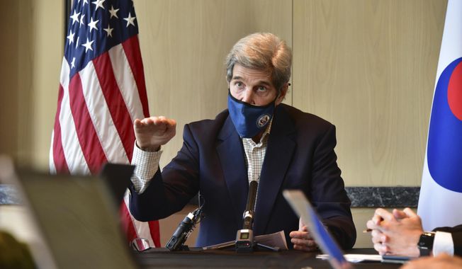 In this photo provided by U.S. Embassy Seoul, U.S. special envoy for climate John Kerry gestures while  speaking during a round table meeting with the media in Seoul, South Korea, Sunday, April 18, 2021. The United States and China, the world&#x27;s two biggest carbon polluters, have agreed to cooperate with other countries to curb climate change, just days before U.S. President Joe Biden hosts a virtual summit of world leaders to discuss the issue. (U.S. Embassy Seoul via AP)