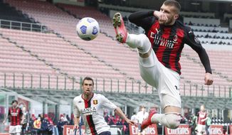 AC Milan&#39;s Ante Rebic in action during the Serie A soccer match between AC Milan and Genoa at the San Siro stadium in Milan, Italy, Sunday, April 18, 2021. (AP Photo/Antonio Calanni)