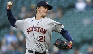 Houston Astros starting pitcher Zack Greinke throws to a Seattle Mariners batter during the first inning of a baseball game Saturday, April 17, 2021, in Seattle. (AP Photo/Ted S. Warren)