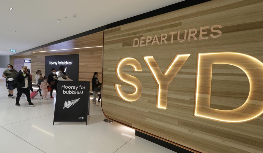 Passengers prepare at Sydney Airport to catch flights in Sydney, Australia, Monday, April 19, 2021, to New Zealand as the much-anticipated travel bubble between Australia and New Zealand opens. (AP Photo/Rick Rycroft) ** FILE **
