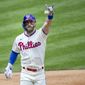 Philadelphia Phillies&#x27; Bryce Harper (3) gestures after crossing the plate on a home run during the first inning of a baseball game against the St. Louis Cardinals, Sunday, April 18, 2021, in Philadelphia. (AP Photo/Laurence Kesterson)