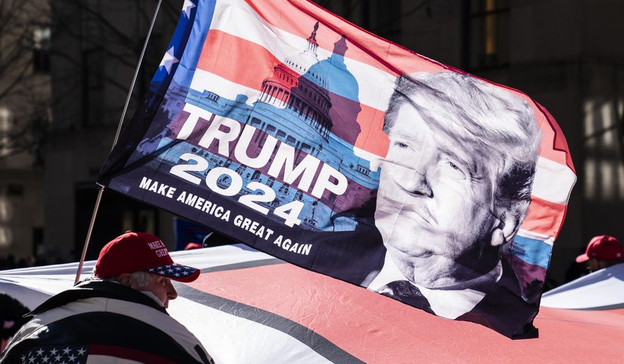 In this March 5, 2021, file photo, protesters supporting former President Donald Trump march down Fifth Avenue on their way toward Times Square in New York. (AP Photo/John Minchillo) ** FILE **