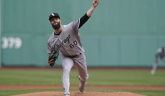 Chicago White Sox&#39;s Dallas Keuchel delivers a pitch against the Boston Red Sox in the first inning of a baseball game, Sunday, April 18, 2021, in Boston. (AP Photo/Steven Senne)