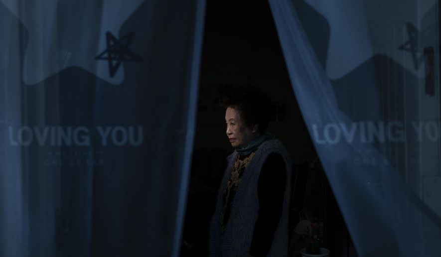 Hea Kyung Kim, an 81-year-old South Korean immigrant, pauses for photos in her apartment in the Koreatown neighborhood of Los Angeles, Wednesday, March 24, 2021. "My children tell me to be careful these days," said Kim. "I have never been a hate crime victim, but it scares me watching the news about it. There is no guarantee it won't happen to me ever." (AP Photo/Jae C. Hong)
